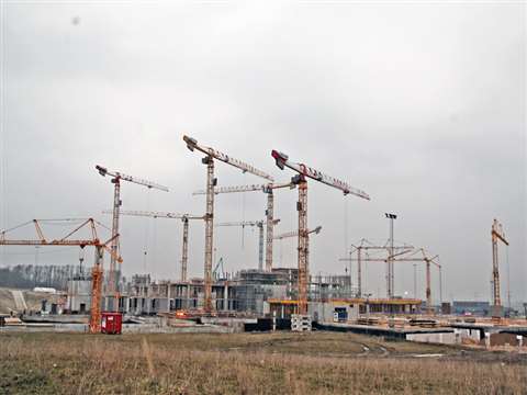 127317 fleet of potain cranes helping to build massive hospital complex in denmark 1