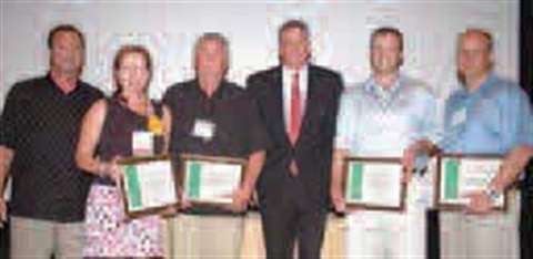 Randy Goddard, left, and Terry Young, third from right, present Safety Awards to: George Young Compa