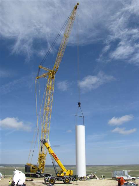 A Kobleco SL6000 erects a wind tower base section.