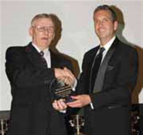 James Mike Davis accepts the Truck Driver of the Year Award from Doug Williams, SC&amp;RA 2006-2007 